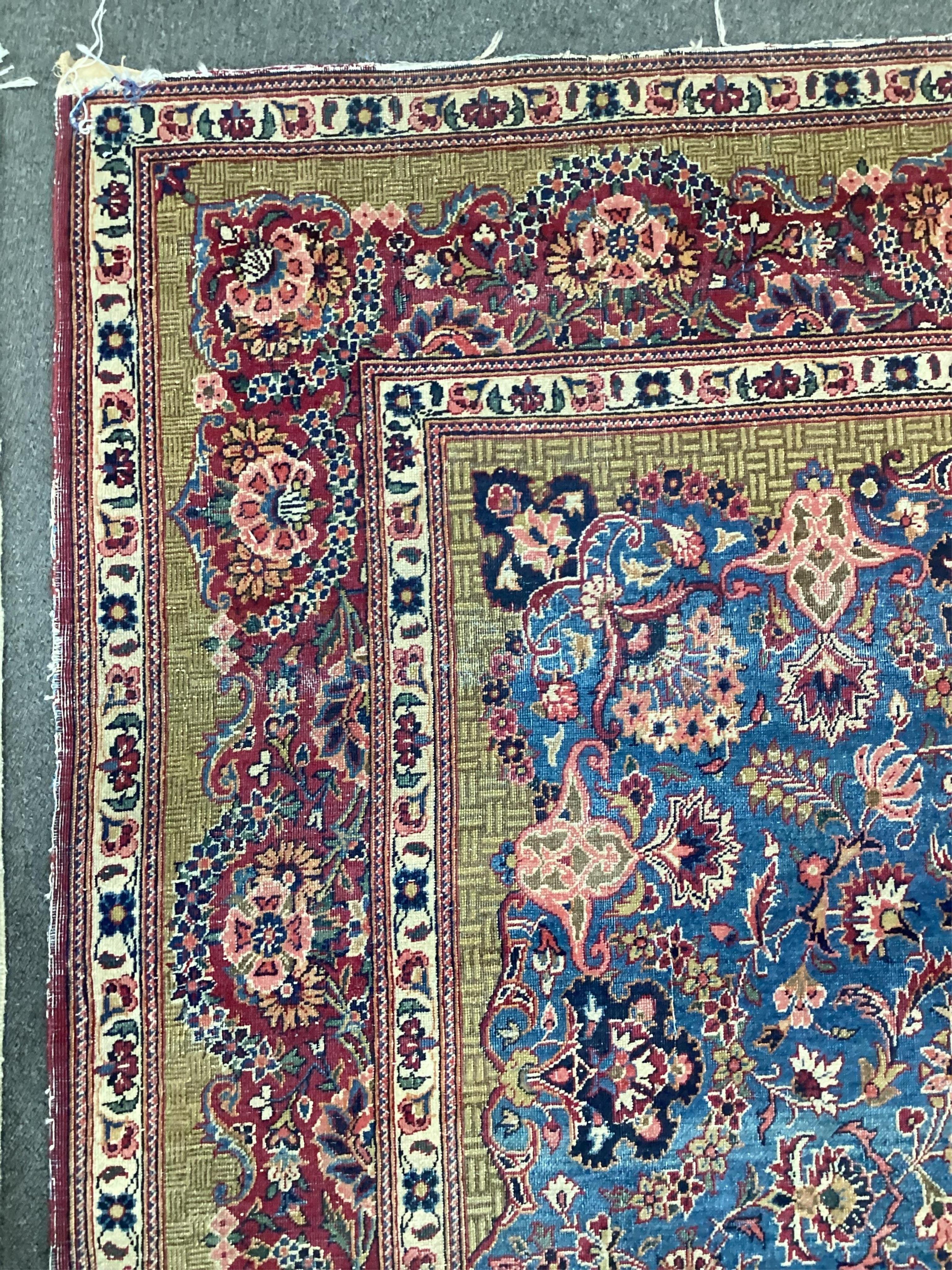 A Kashan blue ground rug, 214 x 128cm. Condition - fair